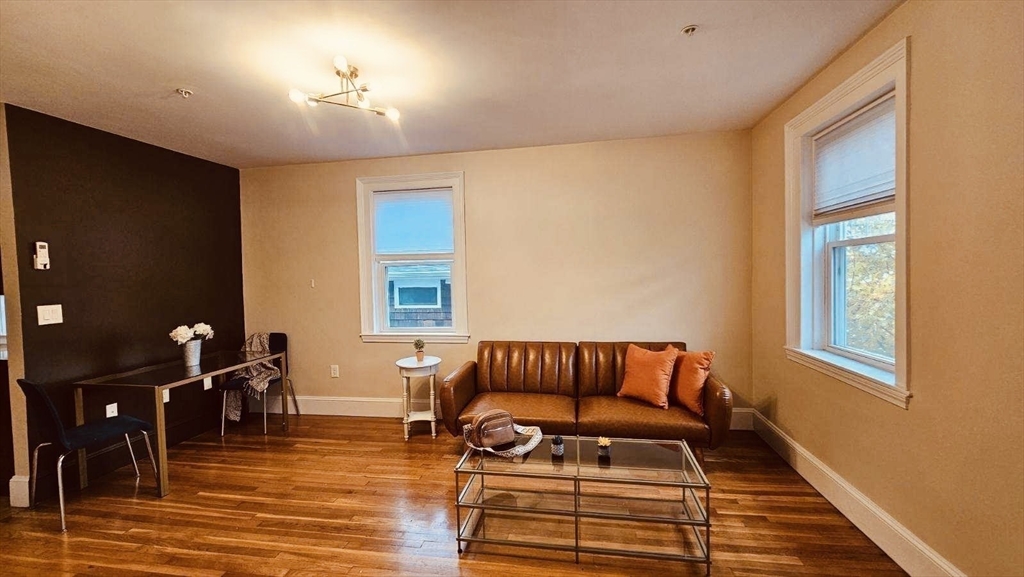 132 North Street, Unit 3 Salem, MA 01970 - Photo 4 of 19 a bedroom with furniture and wooden floor