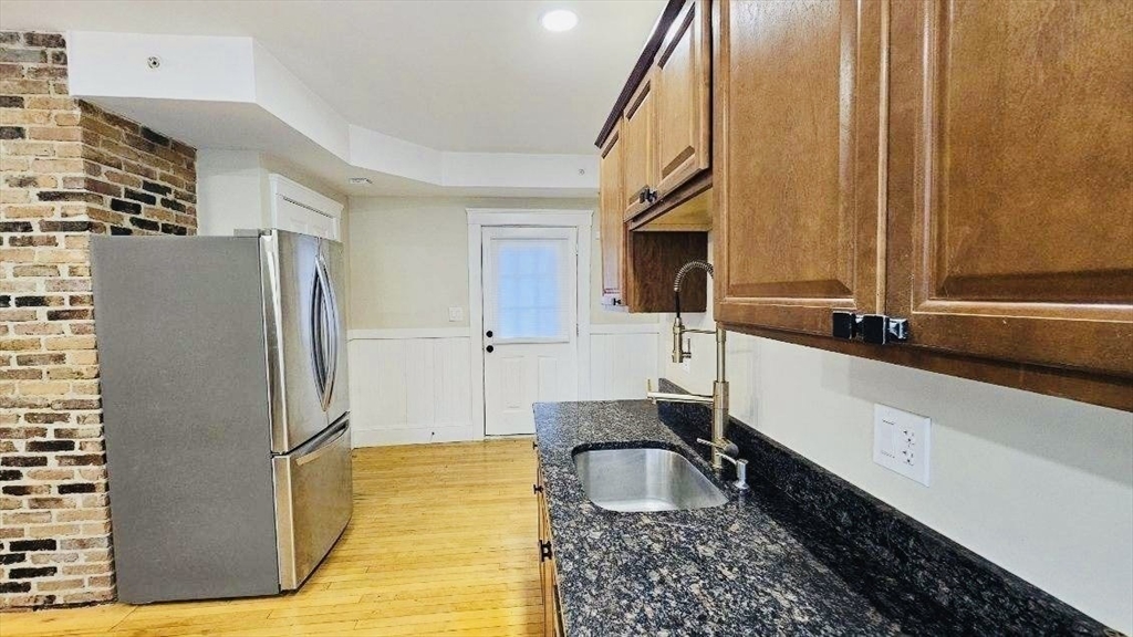 132 North Street, Unit 3 Salem, MA 01970 - Photo 9 of 19 a kitchen with a refrigerator sink and cabinets