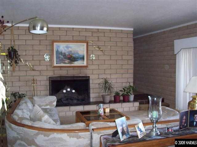 1455 Sioux Trail Reno, NV 89521 - Photo 5 of 9 a living room with furniture and a fireplace