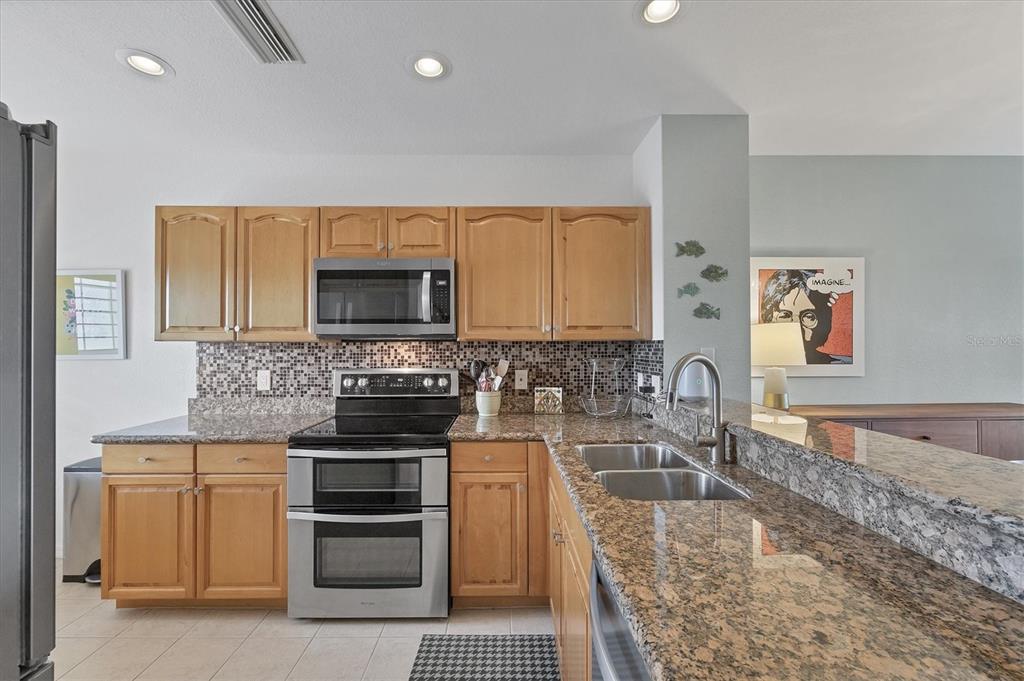 8407 Placida Road, Unit 307 Placida, FL 33946 - Photo 12 of 50 a kitchen with a stove and a sink