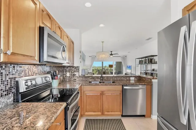 a view of a dining room with furniture wooden floor and chandelier
