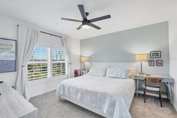 a bedroom with furniture and a window
