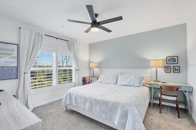 a bedroom with furniture and a window