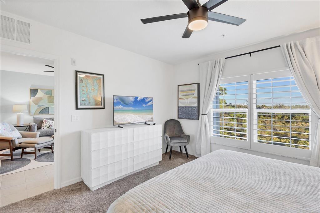 8407 Placida Road, Unit 307 Placida, FL 33946 - Photo 18 of 50 a bedroom with furniture and a window