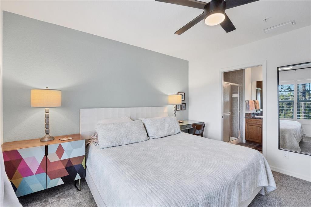 8407 Placida Road, Unit 307 Placida, FL 33946 - Photo 19 of 50 a bedroom with a bed and lamp