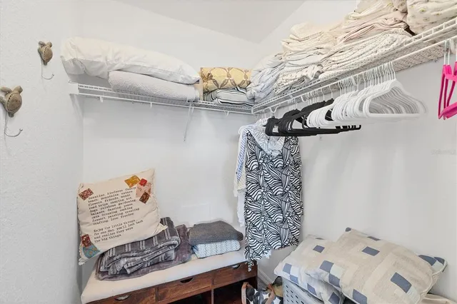a bathroom with granite countertop a sink and a mirror