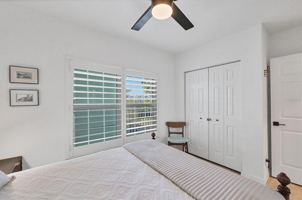 8407 Placida Road, Unit 307 Placida, FL 33946 - Photo 25 of 50 a bedroom with a bed and a window