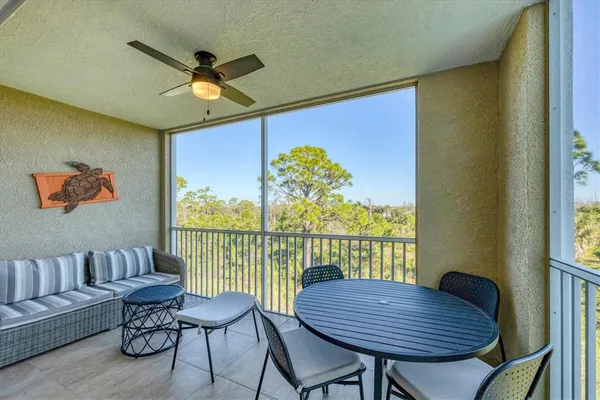a view of a balcony with furniture