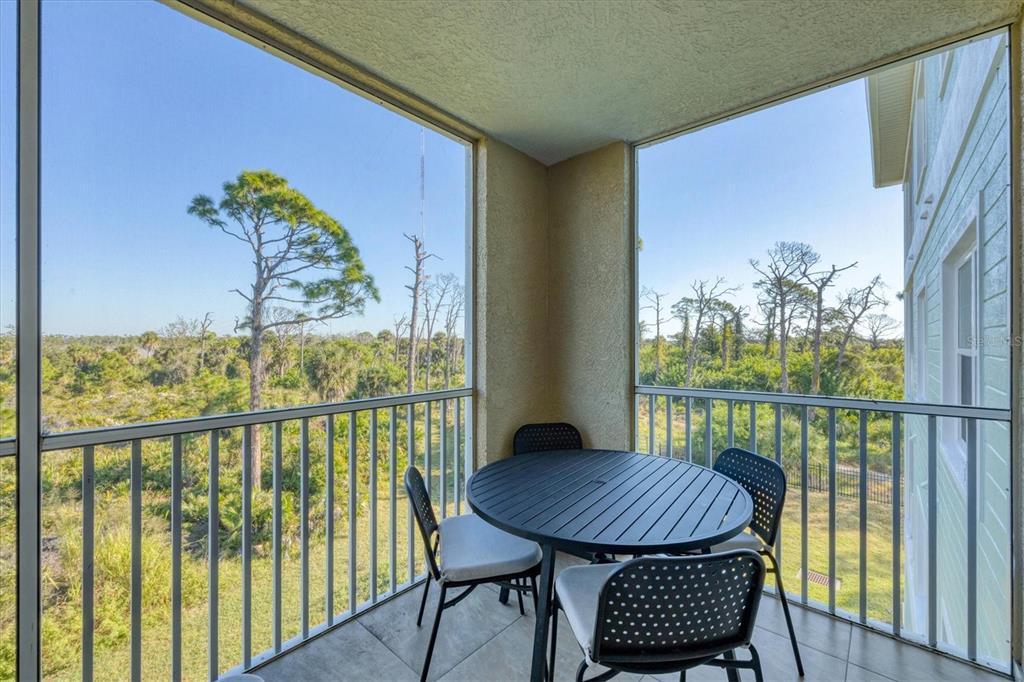 8407 Placida Road, Unit 307 Placida, FL 33946 - Photo 28 of 50 a view of a balcony with furniture