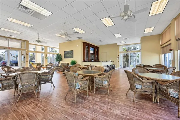 a view of a dining room with furniture and window