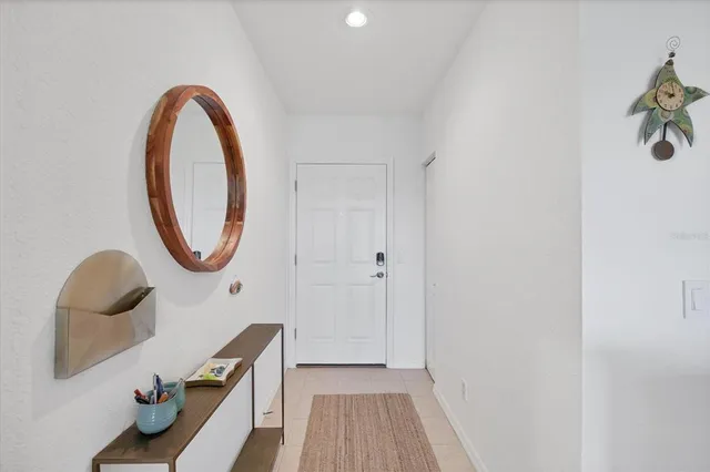 a kitchen with a stove a sink a refrigerator and cabinets