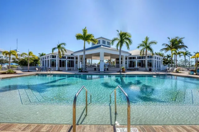 a view of a swimming pool with a lounge chairs