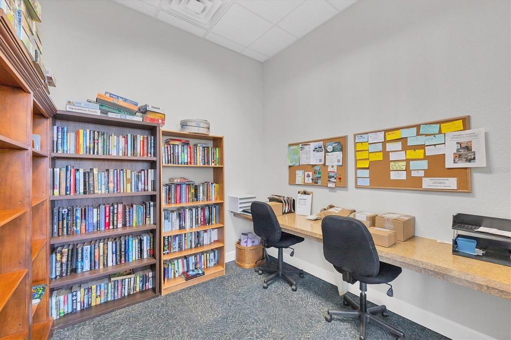 8407 Placida Road, Unit 307 Placida, FL 33946 - Photo 44 of 50 a view of a workspace with a bookshelf and a workspace
