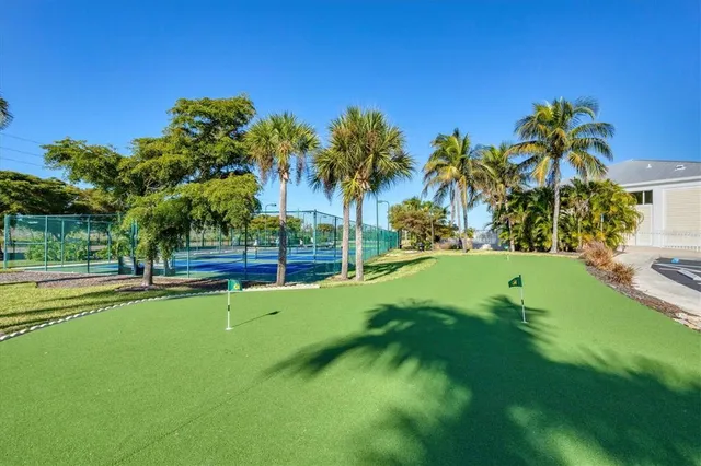 a view of a garden with a building in the background