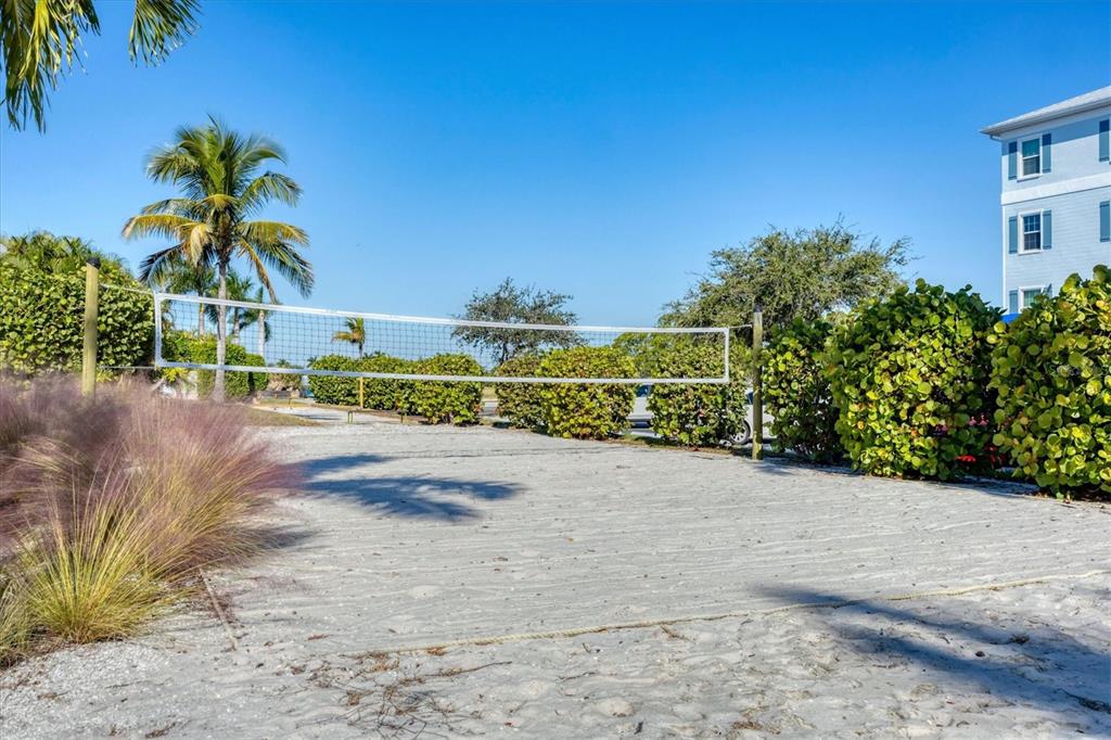 8407 Placida Road, Unit 307 Placida, FL 33946 - Photo 46 of 50 a view of a garden with a building in the background