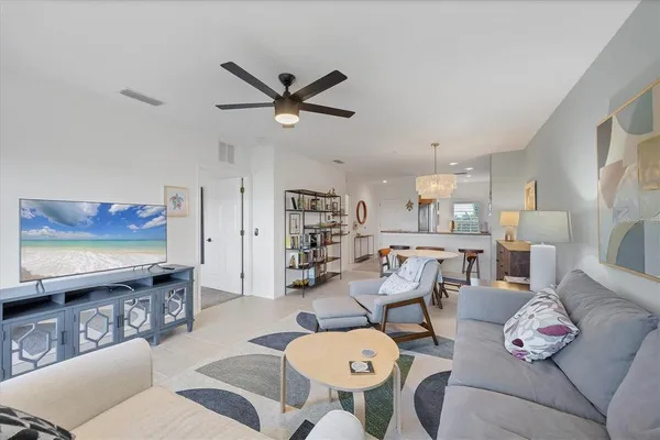 a kitchen with stainless steel appliances granite countertop a sink a stove and a wooden floors
