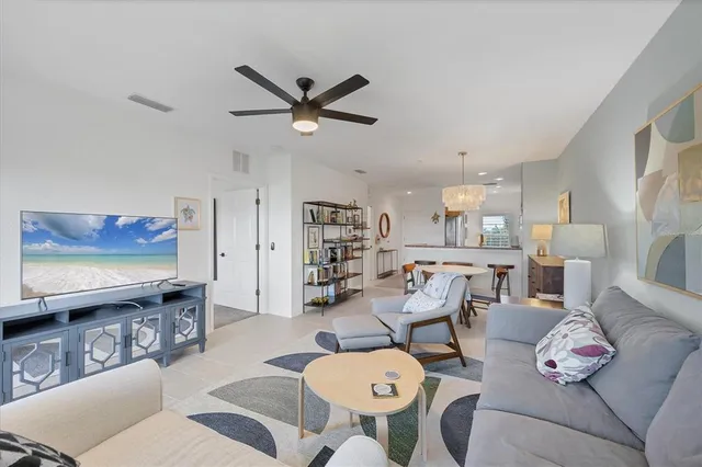 a kitchen with stainless steel appliances granite countertop a sink a stove and a wooden floors