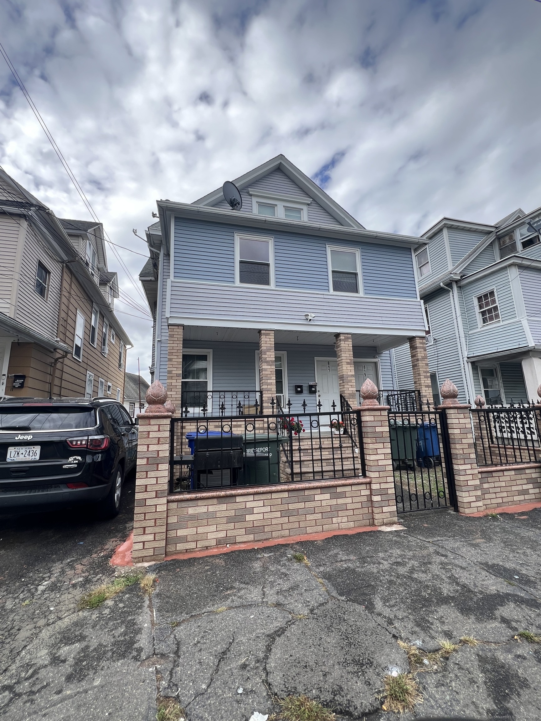 819 William Street, Unit 2 Bridgeport, CT 06608 - Photo 1 of 11 a view of a car park in front of house