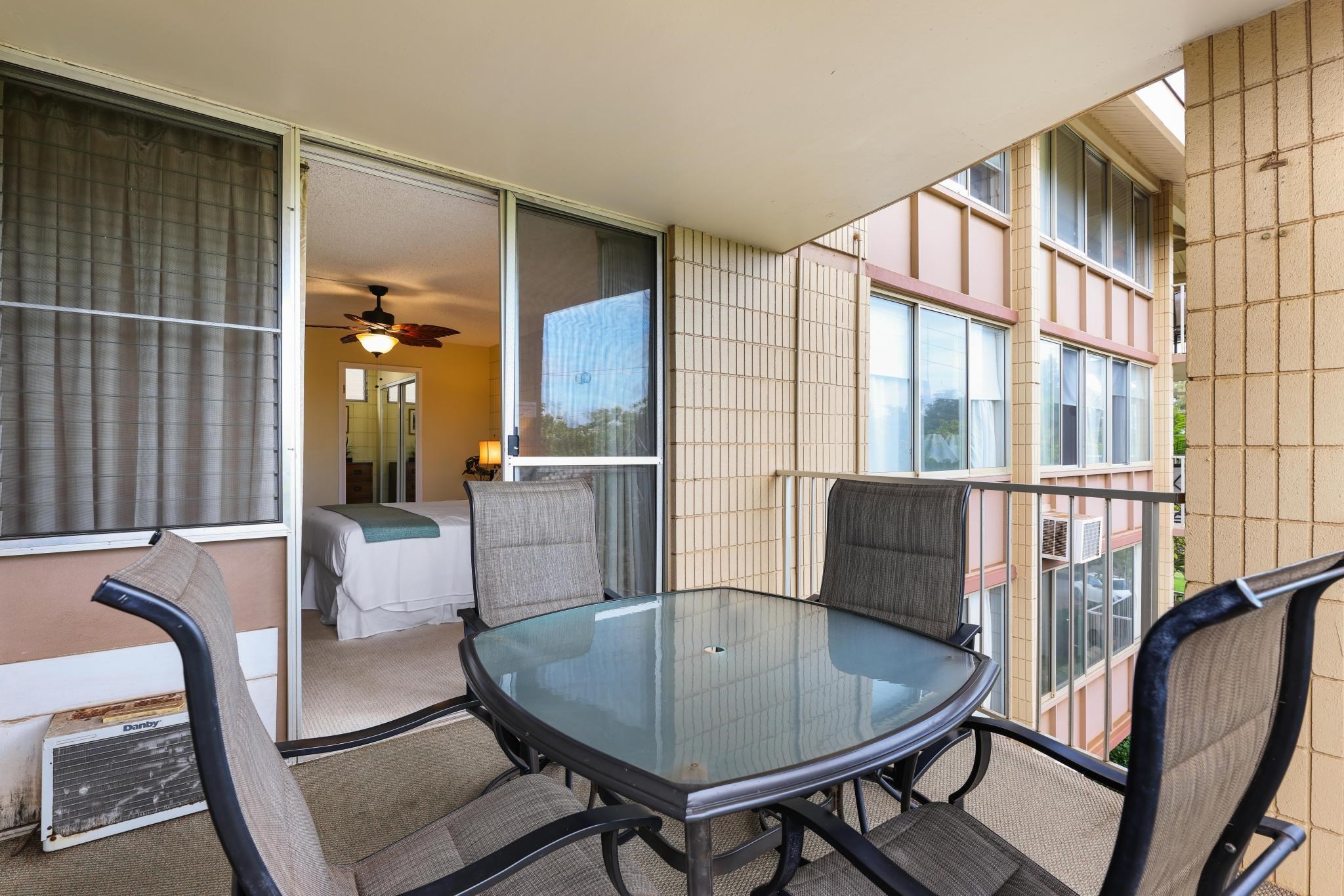 2619 South Kihei Road, Unit A305 Kihei, HI 96753 - Photo 18 of 44 a view of a dining room with furniture window and wooden floor