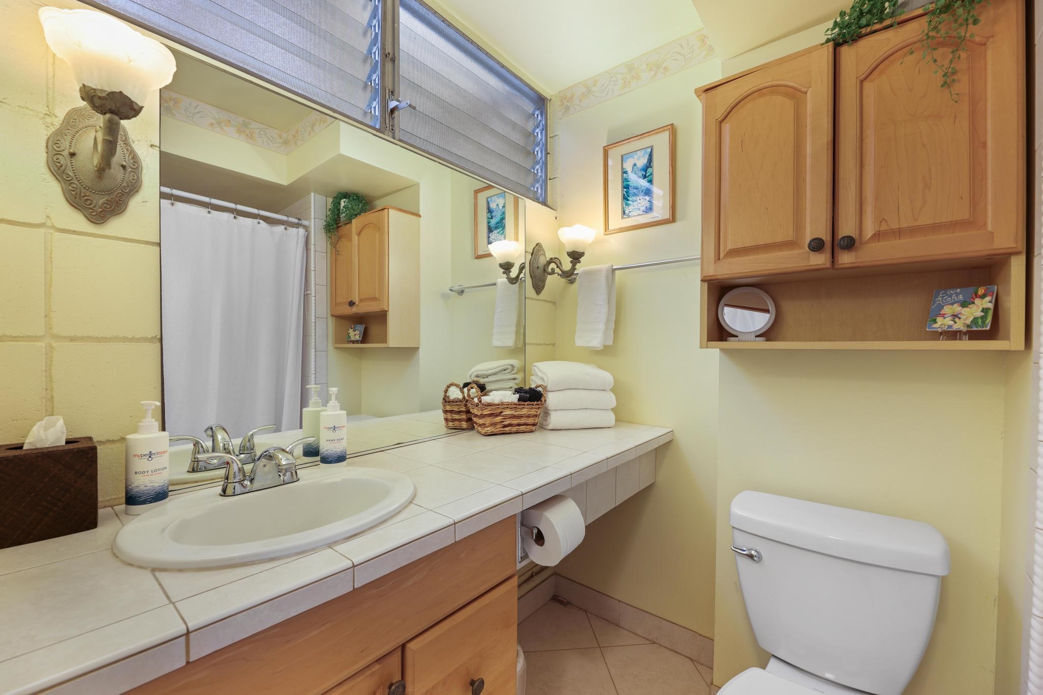 2619 South Kihei Road, Unit A305 Kihei, HI 96753 - Photo 19 of 44 a bathroom with a sink a mirror and a toilet