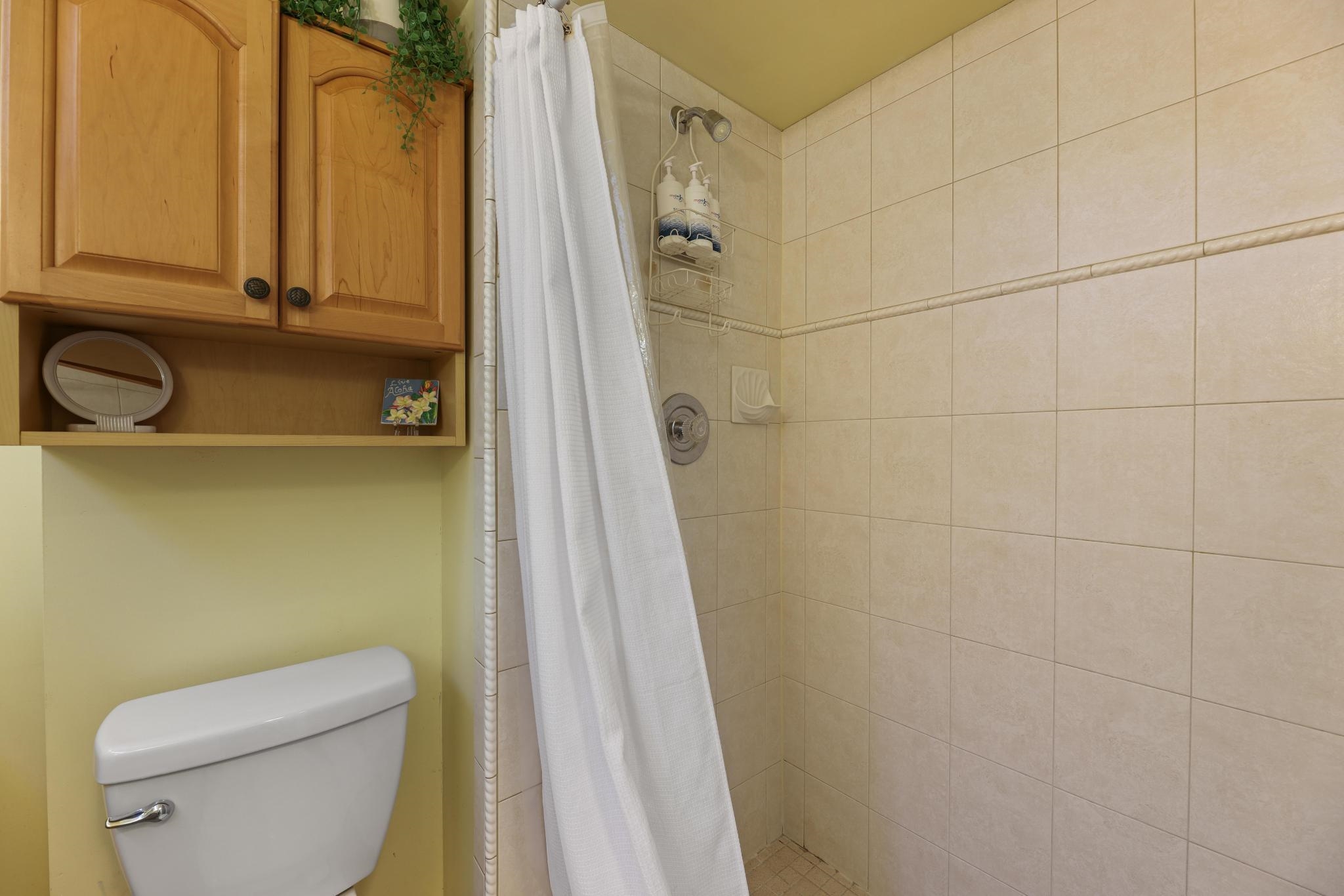 2619 South Kihei Road, Unit A305 Kihei, HI 96753 - Photo 20 of 44 a bathroom with a toilet a sink and shower