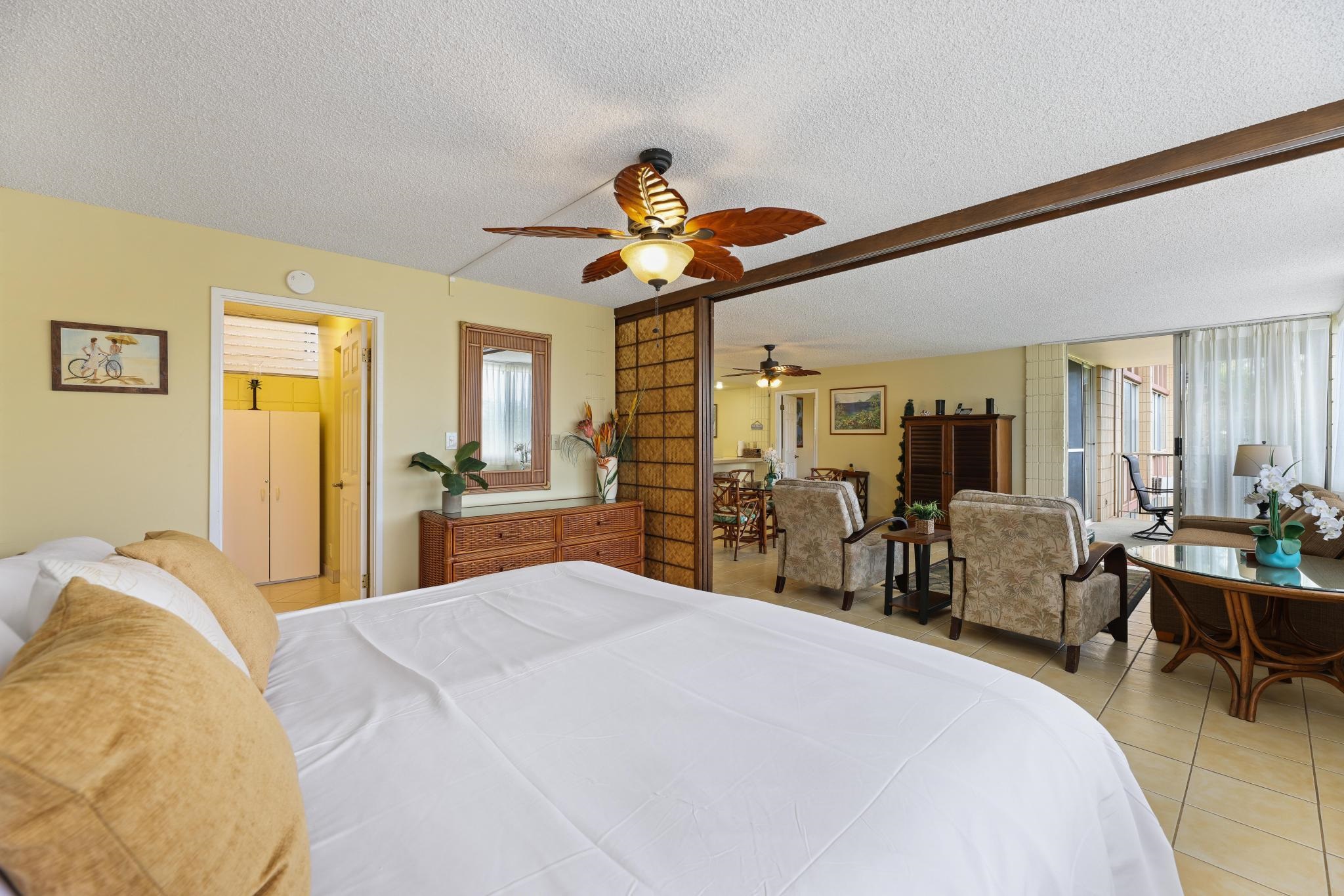 2619 South Kihei Road, Unit A305 Kihei, HI 96753 - Photo 21 of 44 a bedroom with a bed and a chandelier