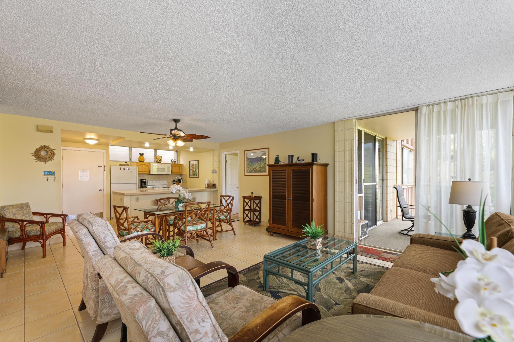 2619 South Kihei Road, Unit A305 Kihei, HI 96753 - Photo 23 of 44 a living room with furniture and a large window