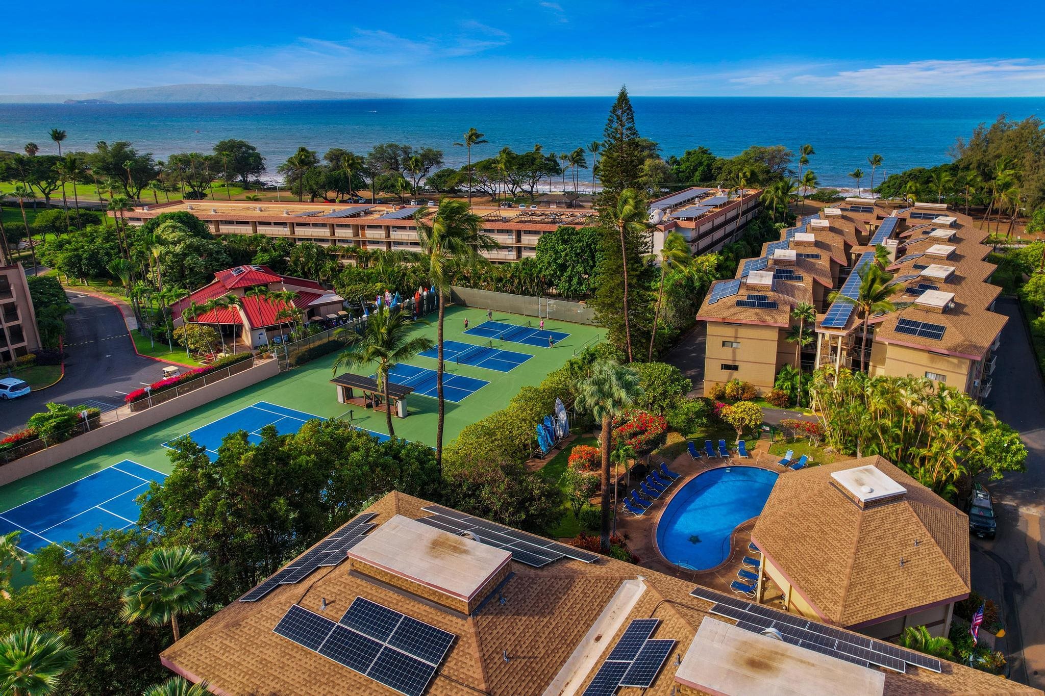 2619 South Kihei Road, Unit A305 Kihei, HI 96753 - Photo 42 of 44 an aerial view of a pool patio outdoor seating and city view