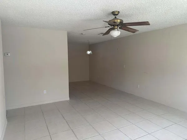 a view of a chandelier fan in a room