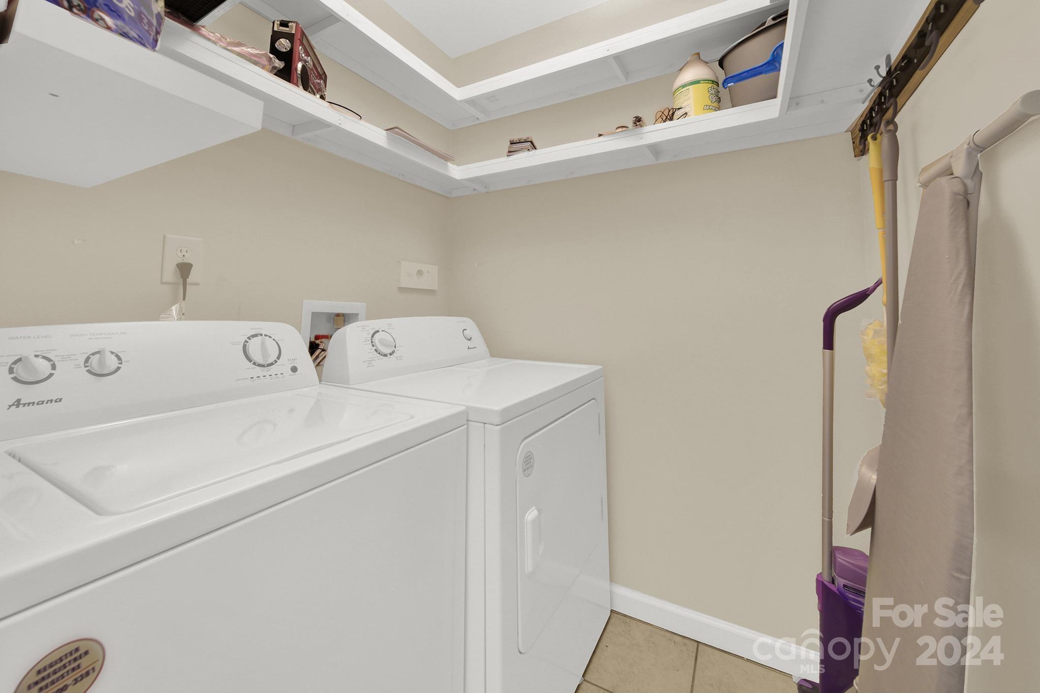 8134 Rudolph Road Charlotte, NC 28216 - Photo 16 of 27 a utility room with dryer and washer