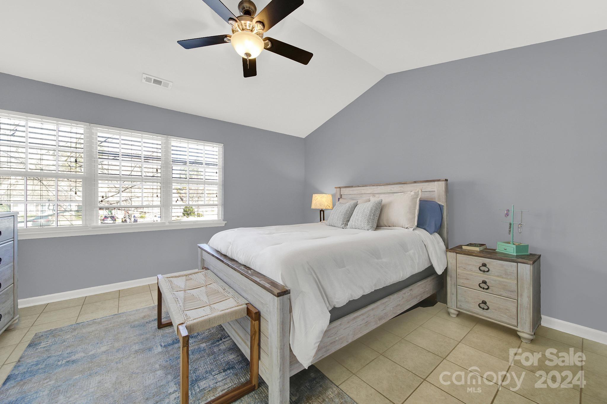 8134 Rudolph Road Charlotte, NC 28216 - Photo 18 of 27 a bedroom with a bed and a window