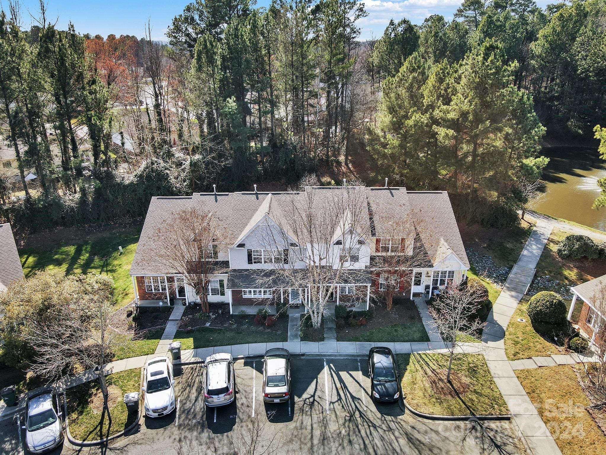8134 Rudolph Road Charlotte, NC 28216 - Photo 4 of 27 an aerial view of a house with swimming pool and outdoor seating