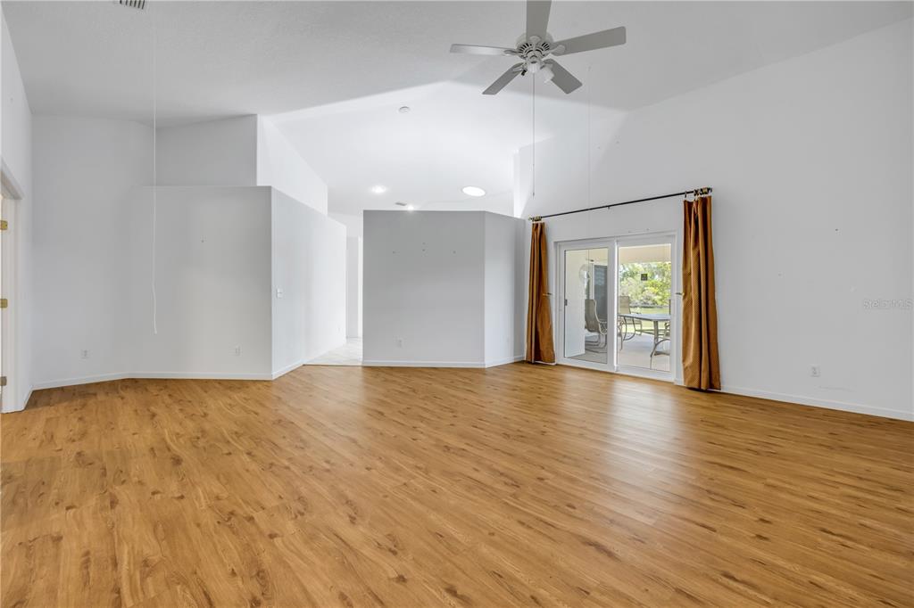 192 Azalea Road Edgewater, FL 32141 - Photo 50 of 94 a view of an empty room with window and wooden floor