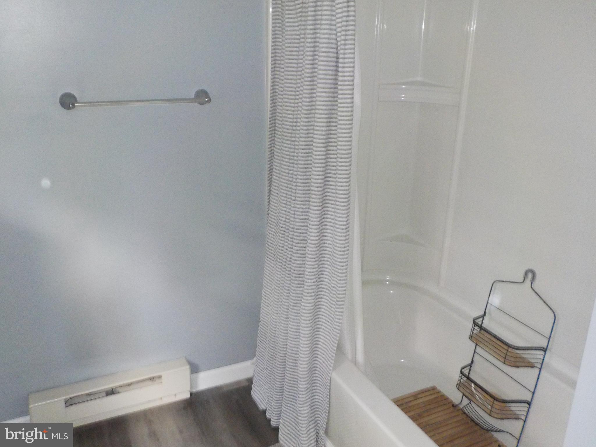 16 Oak Street, Unit R Salem, NJ 08079 - Photo 11 of 20 a bathroom with a granite countertop bathtub shower and toilet