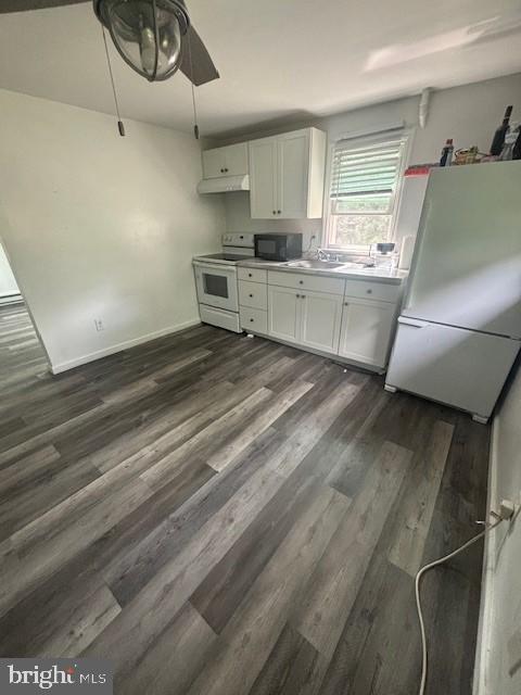16 Oak Street, Unit R Salem, NJ 08079 - Photo 16 of 20 a view of kitchen with sink microwave and cabinets