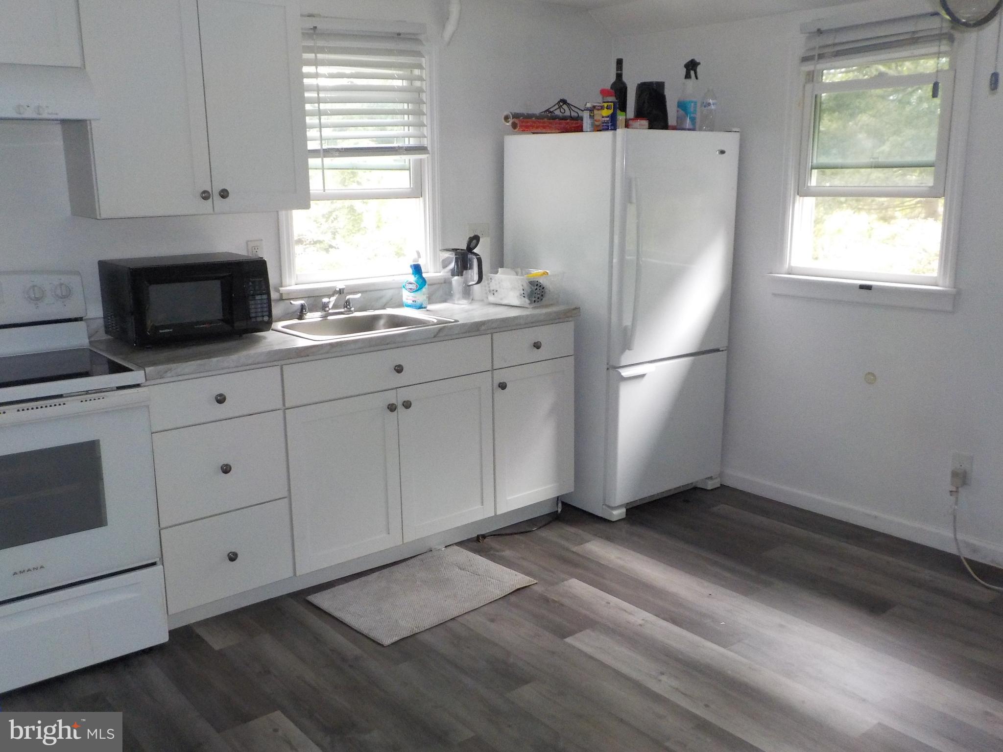 16 Oak Street, Unit R Salem, NJ 08079 - Photo 3 of 20 a white refrigerator freezer sitting in a kitchen