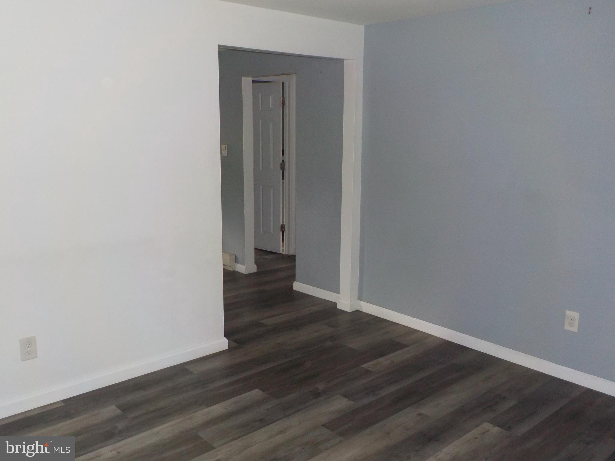 16 Oak Street, Unit R Salem, NJ 08079 - Photo 8 of 20 a view of an empty room with wooden floor