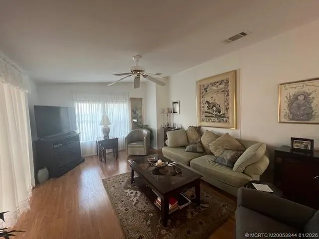 a living room with furniture and a table