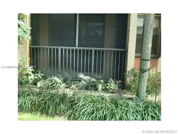 a view of outdoor space with deck and garden