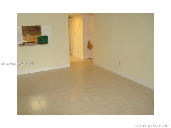 a picture of an empty room with a window