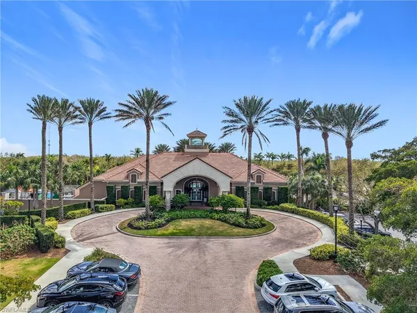 an aerial view of a house with a garden and a yard