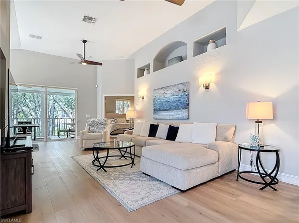 a living room with furniture and a table
