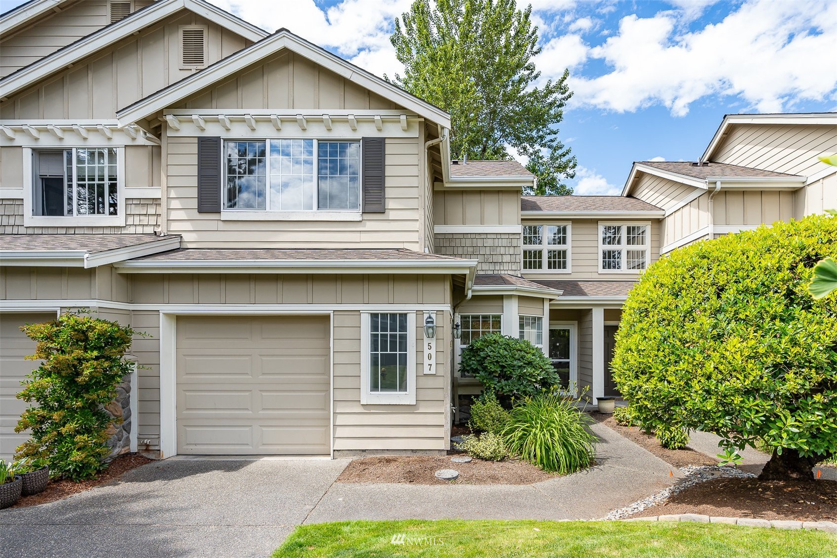507 Elma Place Northeast Renton, WA 98059 - Photo 1 of 36 a front view of a house with a yard