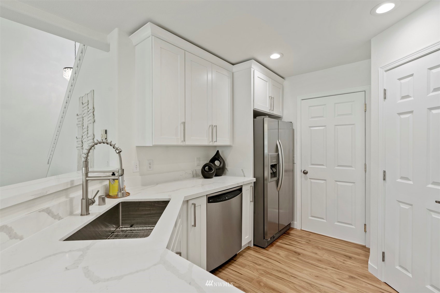 507 Elma Place Northeast Renton, WA 98059 - Photo 21 of 36 a kitchen with a refrigerator sink and cabinets