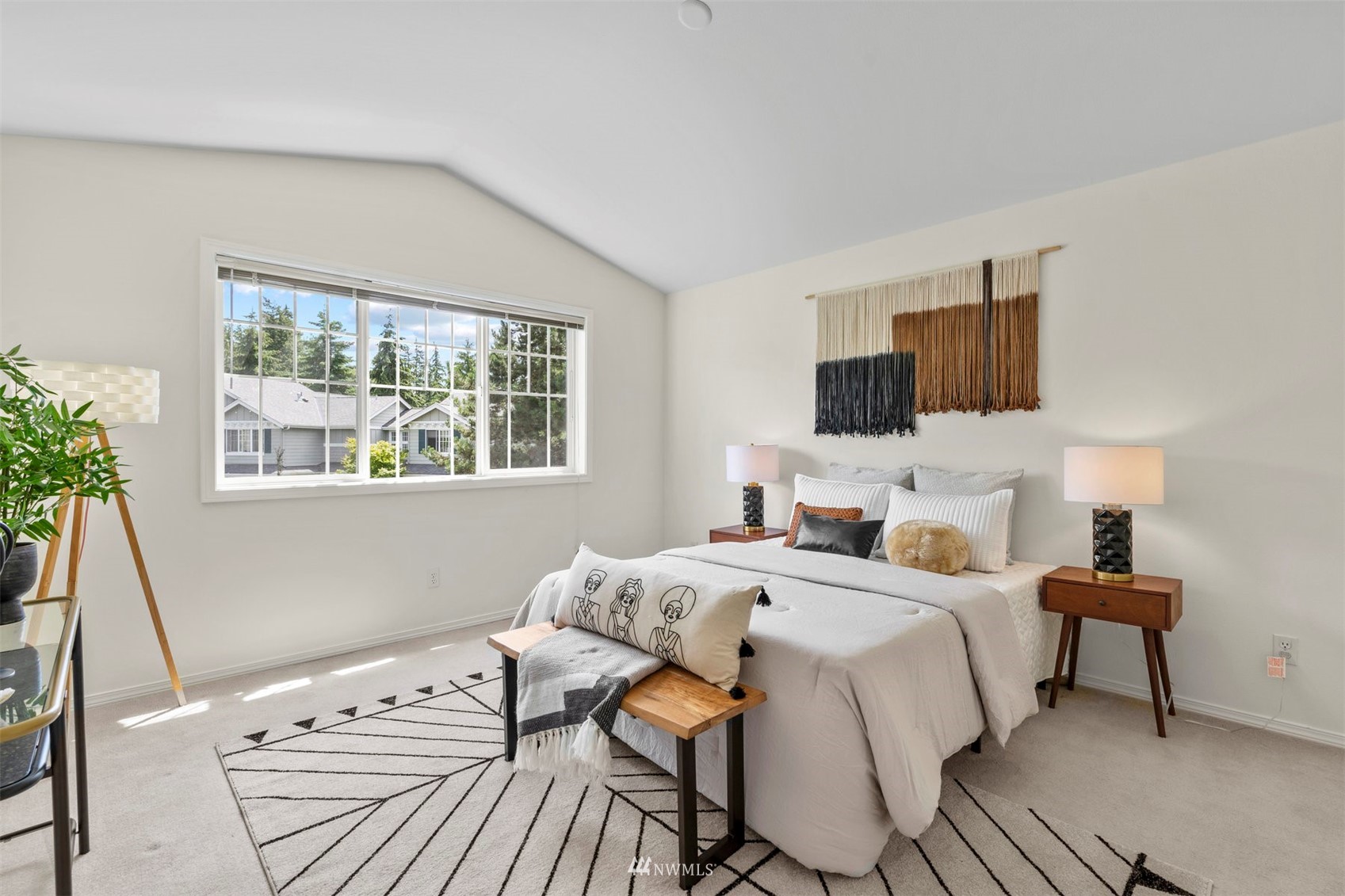 507 Elma Place Northeast Renton, WA 98059 - Photo 23 of 36 a bedroom with a bed and a flat screen tv