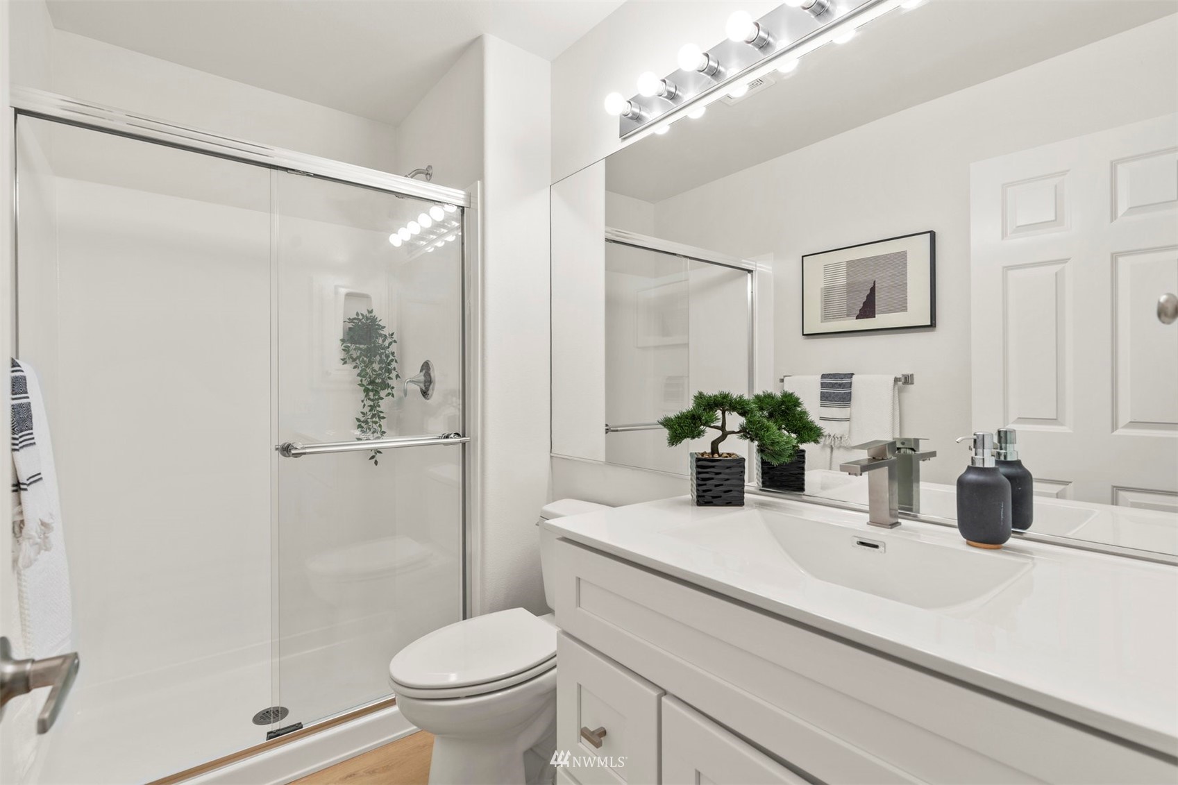 507 Elma Place Northeast Renton, WA 98059 - Photo 27 of 36 a bathroom with a sink a toilet and shower