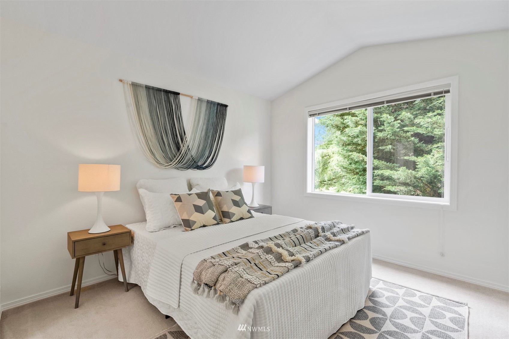 507 Elma Place Northeast Renton, WA 98059 - Photo 29 of 36 a bedroom with a bed and a painting on the wall