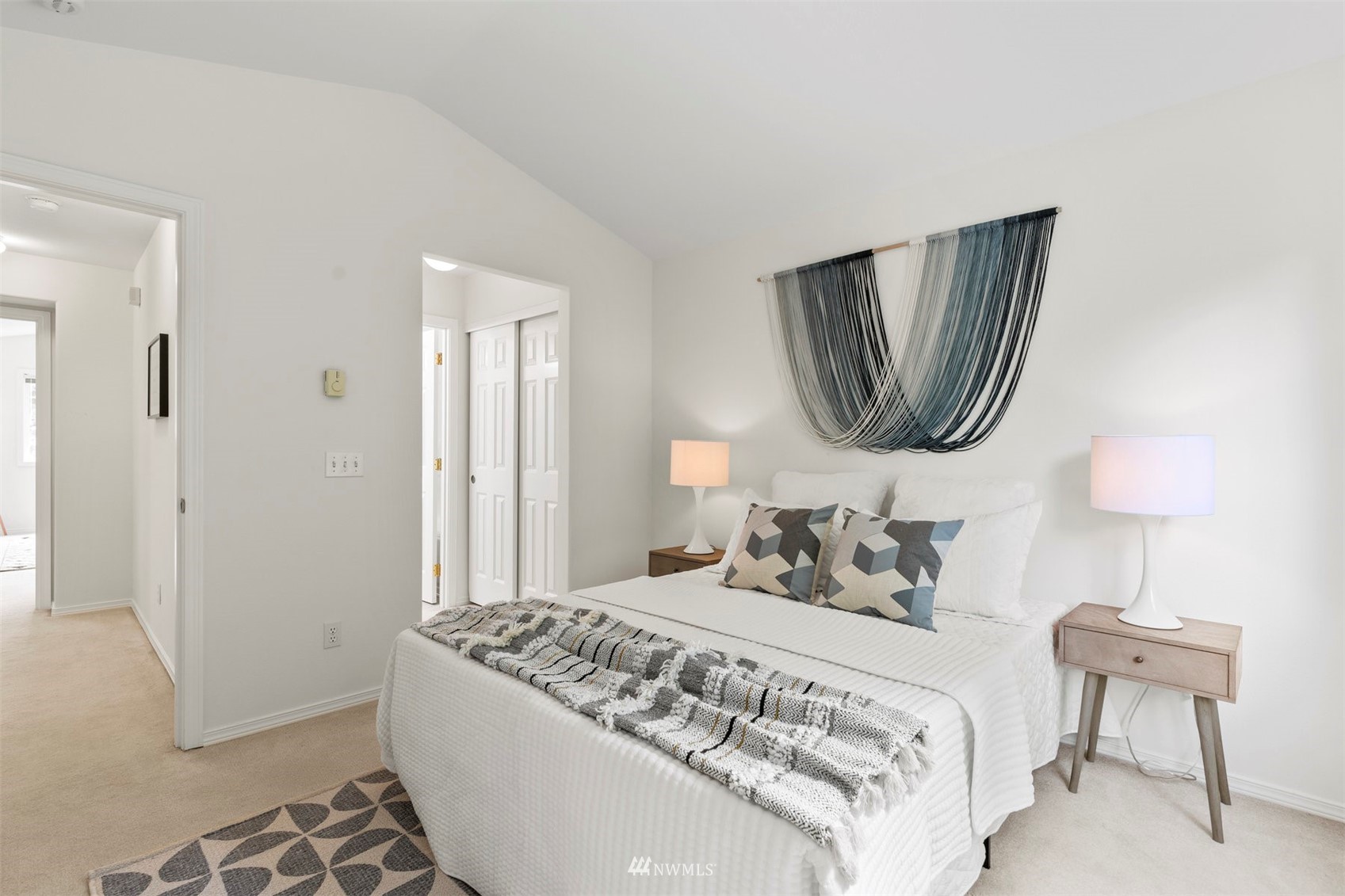 507 Elma Place Northeast Renton, WA 98059 - Photo 31 of 36 a bedroom with a bed and a lamp