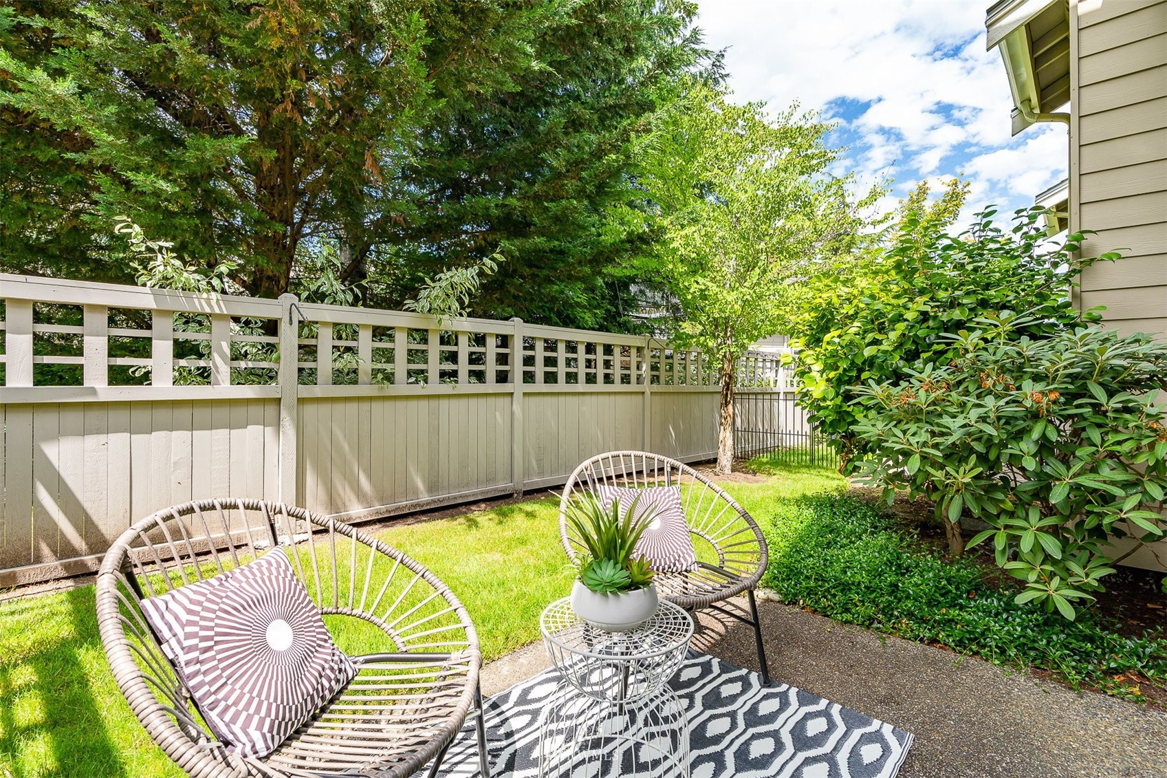 507 Elma Place Northeast Renton, WA 98059 - Photo 34 of 36 a view of a chair and tables in the backyard