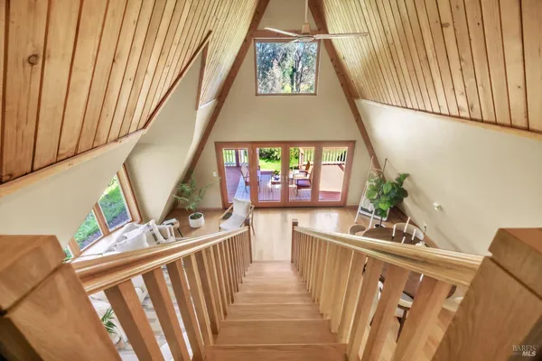 a view of living room with furniture and baby crib